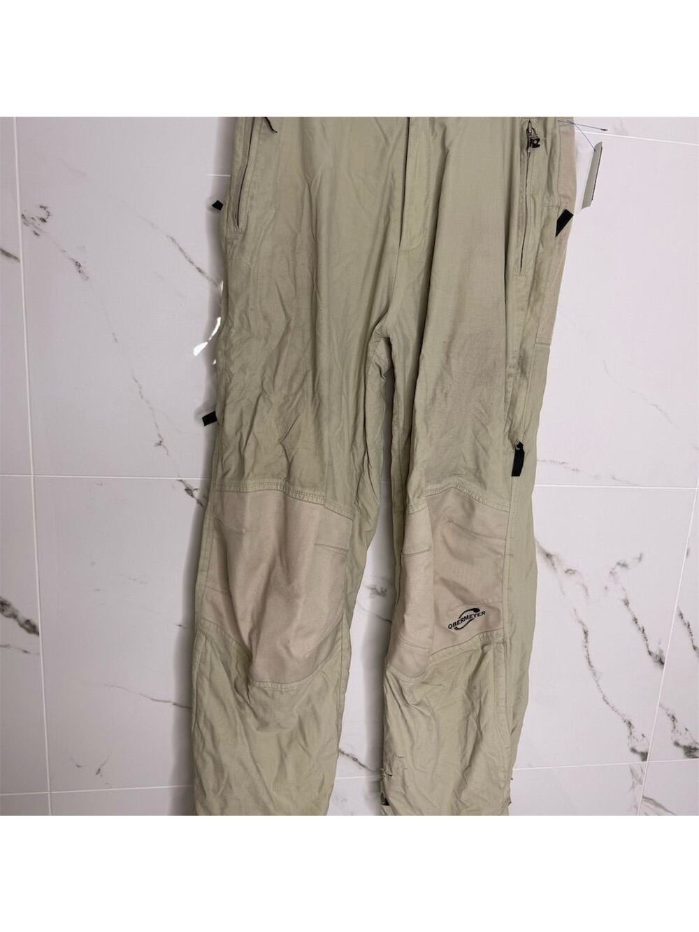 Obermeyer Men's Beige Ski Snow Pants M Zippered Pockets Winter rip at bottom